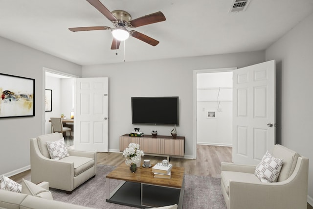21146 Caney Dr, New Caney, TX 77357 - living room with wood finished floors and a ceiling fan