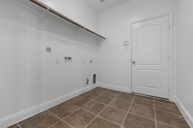 20123 Cascading Falls Blvd, Cypress, TX 77433 - laundry area with hookup for a gas dryer, electric dryer hookup, dark tile patterned flooring, and washer hookup