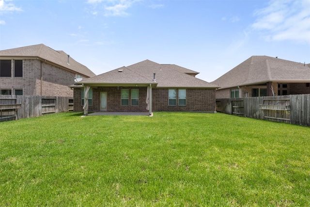 20123 Cascading Falls Blvd, Cypress, TX 77433 - rear view of property featuring a fenced backyard, brick siding, and a patio area