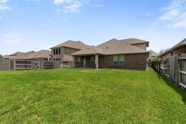 20123 Cascading Falls Blvd, Cypress, TX 77433 - back of house featuring brick siding, a fenced backyard, and roof with shingles