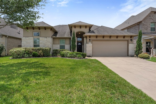 20123 Cascading Falls Blvd, Cypress, TX 77433 - view of front facade featuring an attached garage, concrete driveway, stone siding, stucco siding, and a front yard