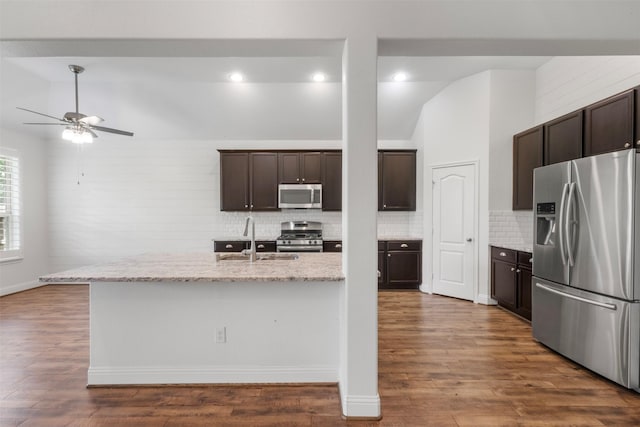 20123 Cascading Falls Blvd, Cypress, TX 77433 - kitchen featuring appliances with stainless steel finishes, backsplash, a ceiling fan, dark brown cabinetry, and dark wood-style floors