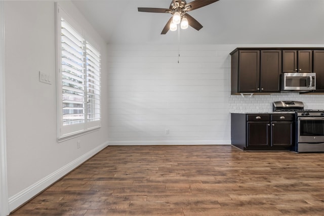 20123 Cascading Falls Blvd, Cypress, TX 77433 - kitchen featuring appliances with stainless steel finishes, ceiling fan, dark wood-type flooring, dark brown cabinetry, and lofted ceiling