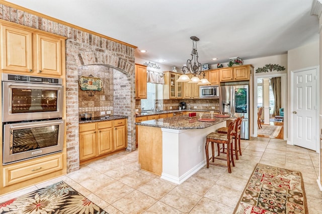 22806 Rachels Manor Dr, Katy, TX 77494 - kitchen featuring stainless steel appliances, healthy amount of natural light, backsplash, dark stone counters, and recessed lighting