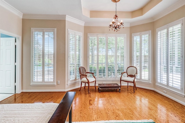 22806 Rachels Manor Dr, Katy, TX 77494 - sitting room with wood finished floors, healthy amount of natural light, a chandelier, and crown molding