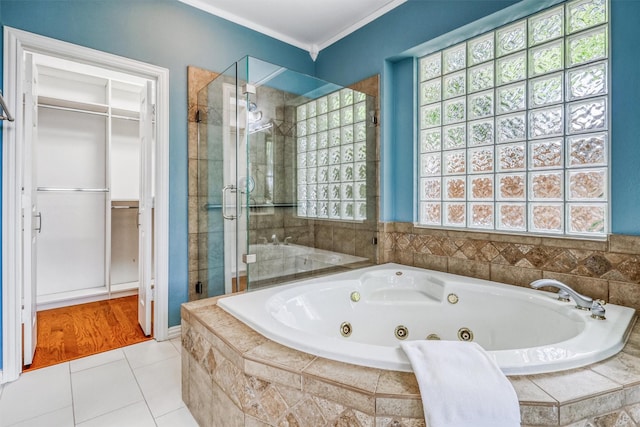 22806 Rachels Manor Dr, Katy, TX 77494 - bathroom featuring a stall shower, plenty of natural light, a whirlpool tub, a spacious closet, and crown molding