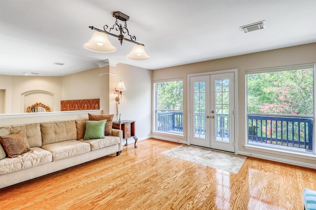 22806 Rachels Manor Dr, Katy, TX 77494 - living area featuring wood finished floors, plenty of natural light, and french doors