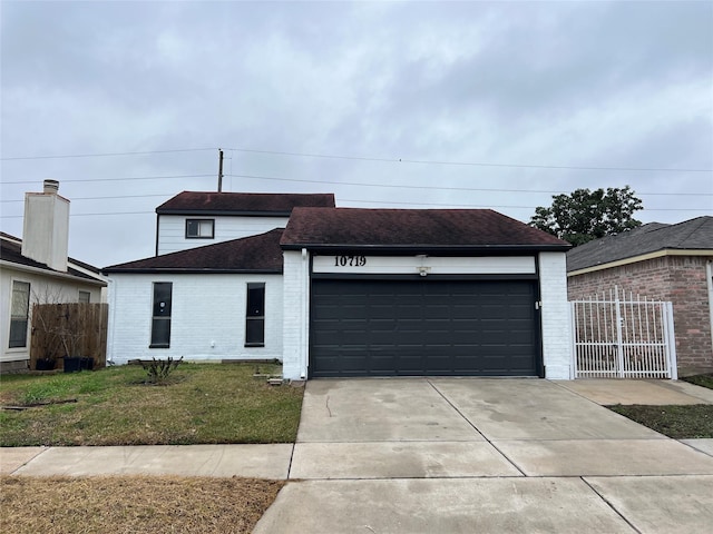 10719 Bellfair Dr, Houston, TX 77072 - view of front facade with roof with shingles, brick siding, a garage, and concrete driveway