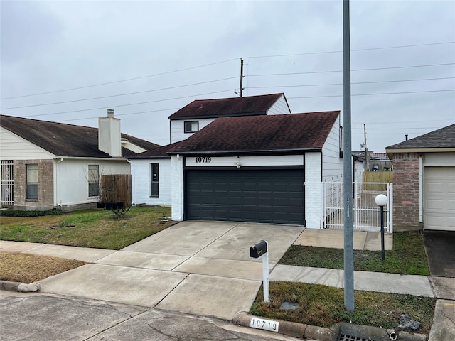 10719 Bellfair Dr, Houston, TX 77072 - view of front of property featuring brick siding, driveway, a shingled roof, and a garage