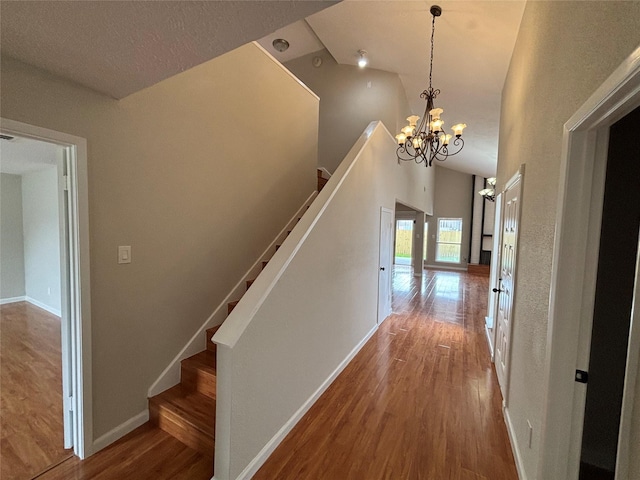 10719 Bellfair Dr, Houston, TX 77072 - hall with wood finished floors, a chandelier, a high ceiling, and stairway