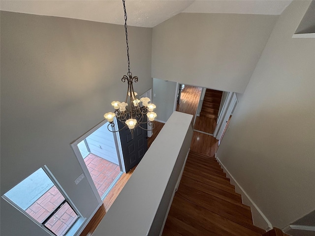 10719 Bellfair Dr, Houston, TX 77072 - stairway featuring wood finished floors, a chandelier, and high vaulted ceiling