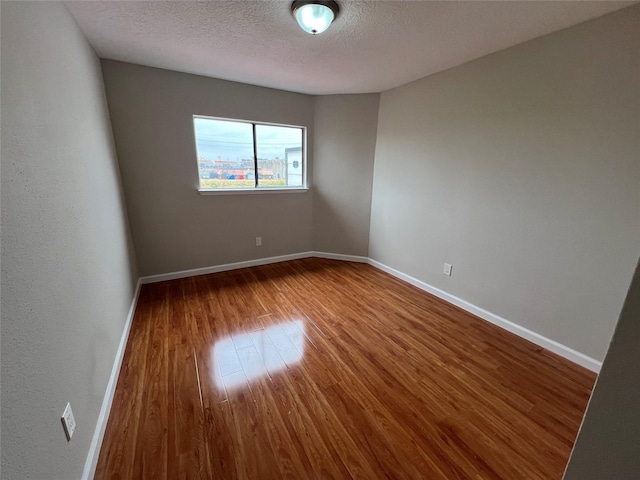 10719 Bellfair Dr, Houston, TX 77072 - spare room featuring wood finished floors and a textured ceiling