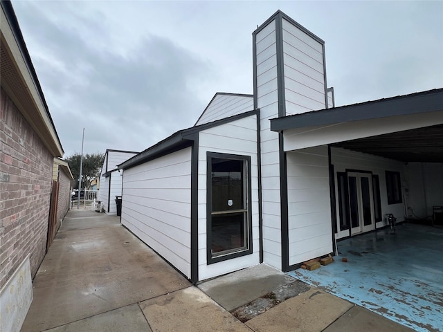 10719 Bellfair Dr, Houston, TX 77072 - view of property exterior featuring a patio area and a chimney