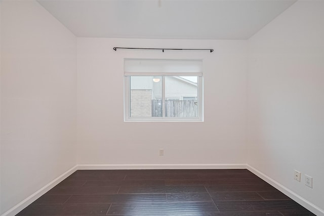 3407 Hillstone Dr, Sugar Land, TX 77479 - spare room with baseboards and dark wood-type flooring