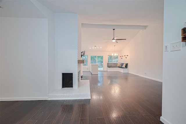 3407 Hillstone Dr, Sugar Land, TX 77479 - unfurnished living room featuring a fireplace, ceiling fan, wood finished floors, lofted ceiling, and a chandelier