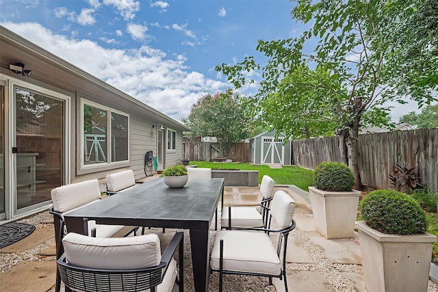 3407 Hillstone Dr, Sugar Land, TX 77479 - fenced backyard featuring outdoor dining area, a shed, and a patio