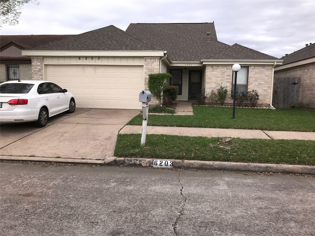 6203 Gladewell Dr, Houston, TX 77072 - view of front facade featuring roof with shingles, a garage, concrete driveway, and brick siding