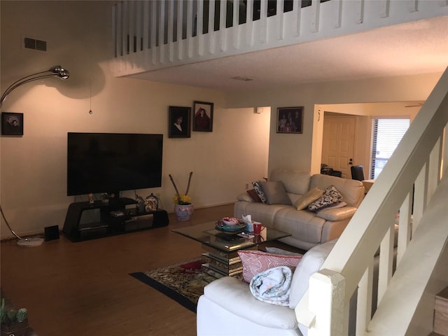 6203 Gladewell Dr, Houston, TX 77072 - living room featuring wood finished floors and stairs