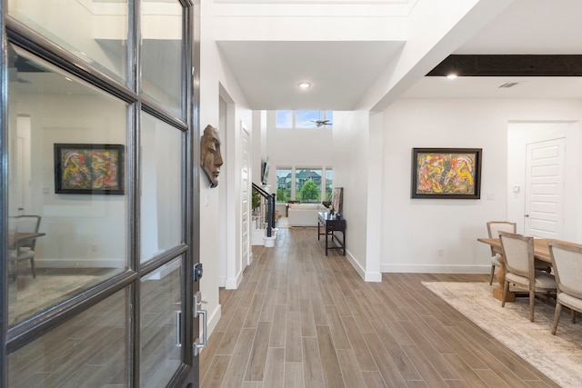 11111 Heartleaf Aster Way, Cypress, TX 77433 - hall featuring light wood-type flooring, recessed lighting, and stairs