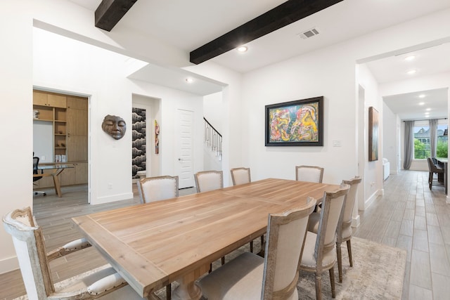 11111 Heartleaf Aster Way, Cypress, TX 77433 - dining room with beamed ceiling, light wood-style flooring, stairs, recessed lighting, and a desk