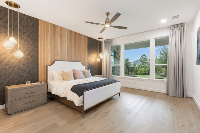 11111 Heartleaf Aster Way, Cypress, TX 77433 - bedroom with light wood-type flooring and a ceiling fan