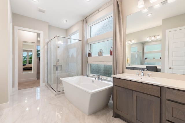 11111 Heartleaf Aster Way, Cypress, TX 77433 - full bath featuring a shower stall, a freestanding bath, vanity, marble tiled flooring, and connected bathroom