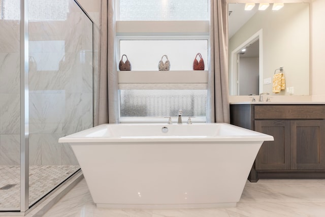 11111 Heartleaf Aster Way, Cypress, TX 77433 - bathroom with a freestanding tub, marble finish floors, and vanity