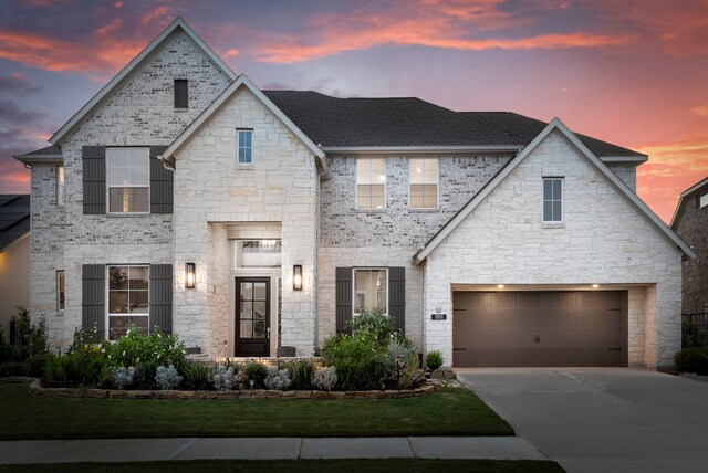 11111 Heartleaf Aster Way, Cypress, TX 77433 - french country home featuring driveway, roof with shingles, and stone siding