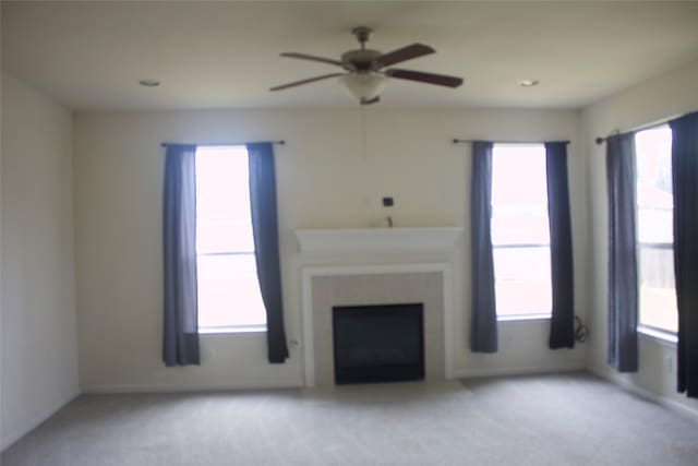 26350 Riley Glen Dr, Richmond, TX 77406 - unfurnished living room with light carpet, ceiling fan, plenty of natural light, and recessed lighting