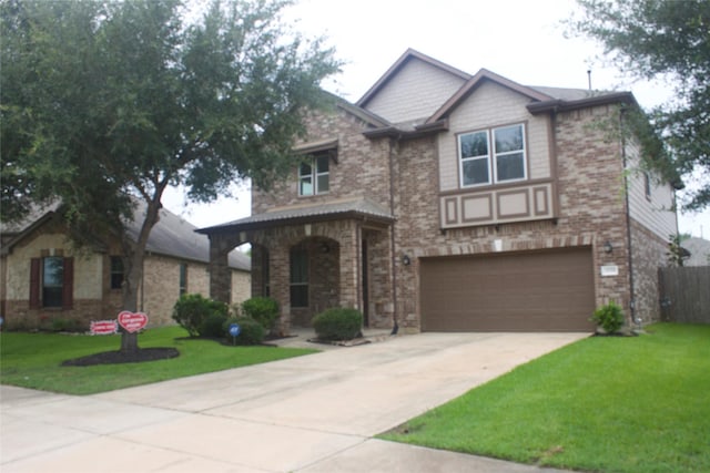 26350 Riley Glen Dr, Richmond, TX 77406 - view of front facade featuring concrete driveway, a garage, a front yard, and brick siding