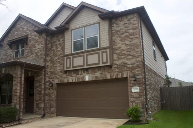 26350 Riley Glen Dr, Richmond, TX 77406 - view of front of house with a garage, brick siding, and concrete driveway