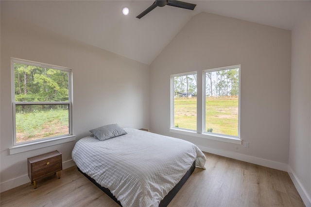 1000 Denson Allen Rd, Coldspring, TX 77331 - bedroom with light wood-style flooring, vaulted ceiling, and a ceiling fan