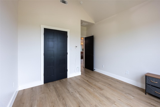 1000 Denson Allen Rd, Coldspring, TX 77331 - unfurnished bedroom featuring light wood-style flooring and high vaulted ceiling