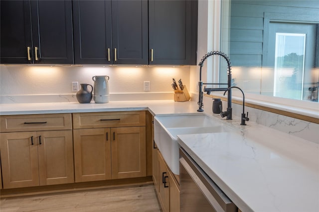 1000 Denson Allen Rd, Coldspring, TX 77331 - kitchen with light stone counters, stainless steel dishwasher, and light wood-style floors