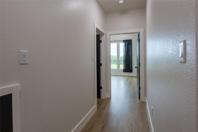 1000 Denson Allen Rd, Coldspring, TX 77331 - hall featuring light wood-type flooring and a textured wall