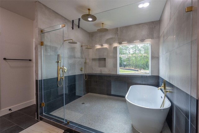 1000 Denson Allen Rd, Coldspring, TX 77331 - full bathroom featuring a stall shower, a soaking tub, tile walls, and recessed lighting