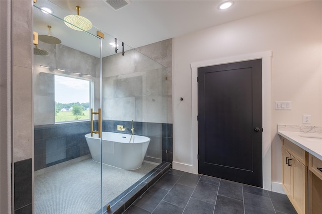1000 Denson Allen Rd, Coldspring, TX 77331 - full bath with a freestanding tub, vanity, an enclosed shower, tile patterned floors, and recessed lighting