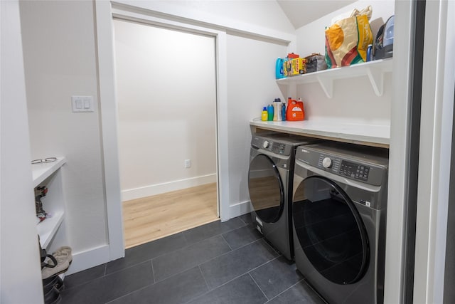 1000 Denson Allen Rd, Coldspring, TX 77331 - washroom featuring washer and clothes dryer and dark tile patterned flooring