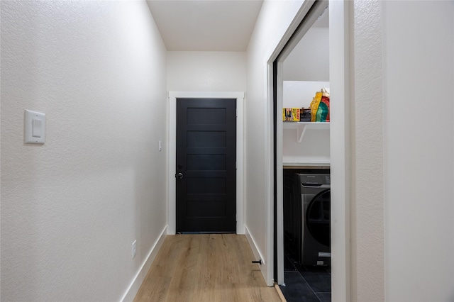 1000 Denson Allen Rd, Coldspring, TX 77331 - laundry area with light wood-style floors and washer / clothes dryer