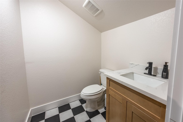 1000 Denson Allen Rd, Coldspring, TX 77331 - half bath with tile patterned floors, lofted ceiling, and vanity