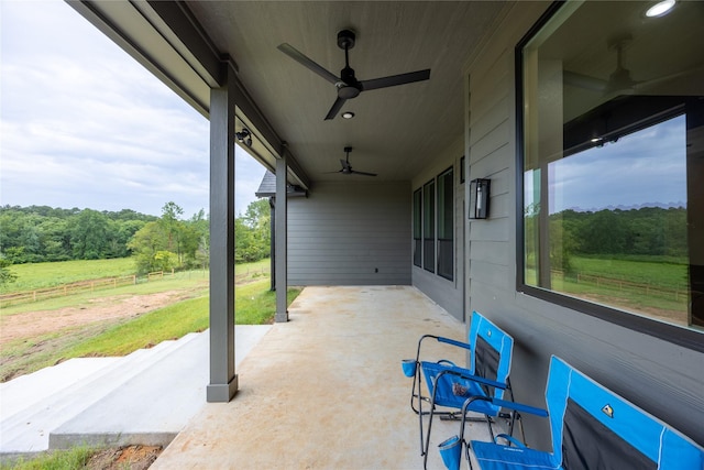 1000 Denson Allen Rd, Coldspring, TX 77331 - view of patio / terrace featuring a ceiling fan and a view of trees