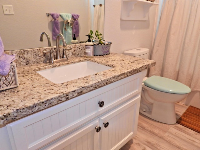 110 Pelican Pl, Surfside Beach, TX 77541 - bathroom featuring vanity and wood finished floors