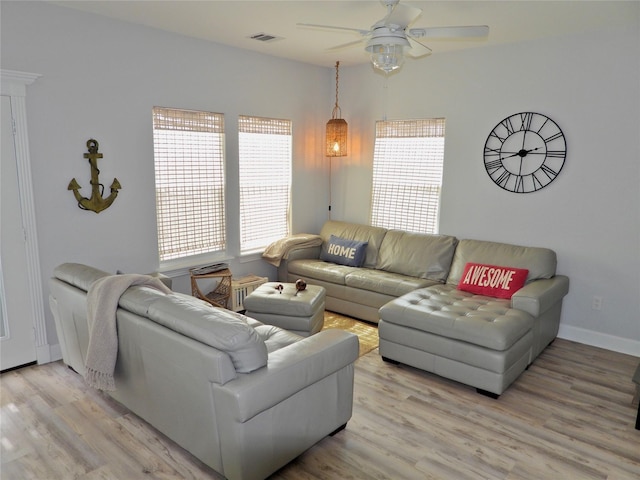 110 Pelican Pl, Surfside Beach, TX 77541 - living area featuring a ceiling fan, plenty of natural light, and light wood-style flooring