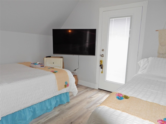 110 Pelican Pl, Surfside Beach, TX 77541 - bedroom featuring wood finished floors and vaulted ceiling