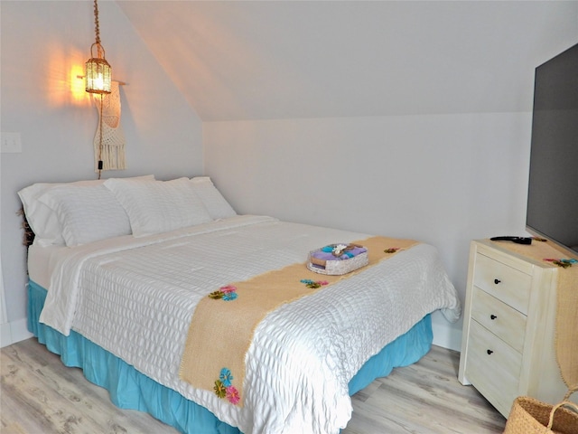 110 Pelican Pl, Surfside Beach, TX 77541 - bedroom with wood finished floors and vaulted ceiling