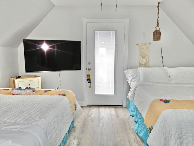 110 Pelican Pl, Surfside Beach, TX 77541 - bedroom featuring vaulted ceiling and wood finished floors