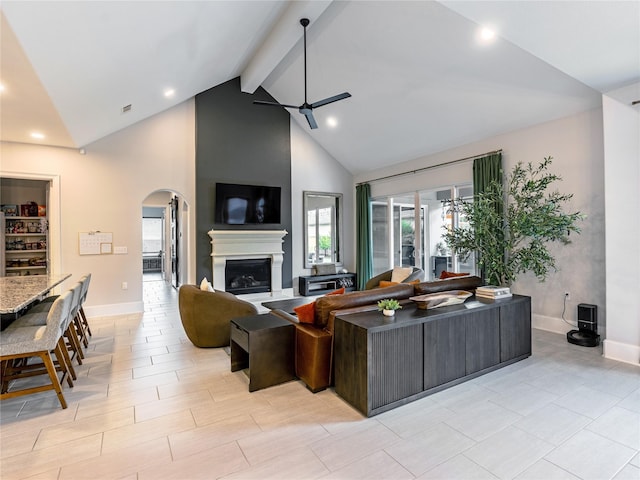 18114 Rainwater Creek Ln, Cypress, TX 77433 - living room featuring arched walkways, a ceiling fan, beam ceiling, high vaulted ceiling, and recessed lighting
