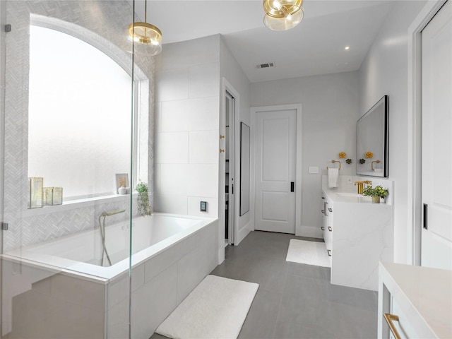 18114 Rainwater Creek Ln, Cypress, TX 77433 - full bathroom featuring vanity, a bath, tile patterned flooring, and recessed lighting