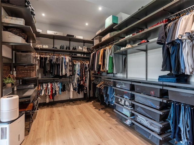 18114 Rainwater Creek Ln, Cypress, TX 77433 - walk in closet with wood finished floors