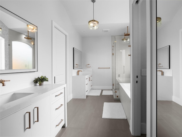 18114 Rainwater Creek Ln, Cypress, TX 77433 - bathroom with a stall shower, tile patterned floors, two vanities, and a bath
